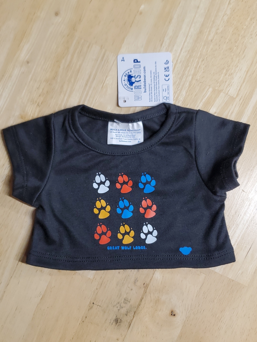 Build-A-Bear Black Tee With Great Wolf Lodge Paw Prints Grid